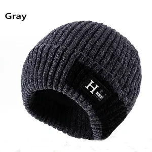 Close-up of gray knit beanie featuring textured ribbing and warm fleece lining detail