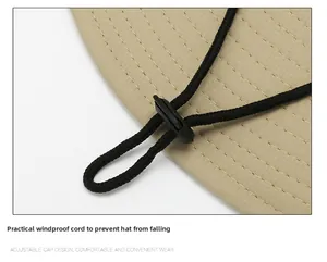 Detail of adjustable windproof rope and fine twill fabric on beige outdoor sun hat