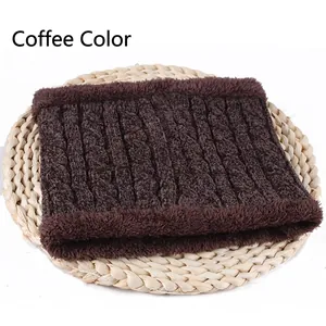 Detail of dark coffee chenille neck warmer featuring cable knit pattern and faux fur trim