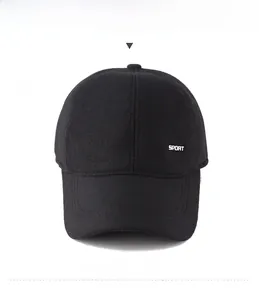 Macro view of black winter wool baseball cap featuring sport metal logo and premium texture