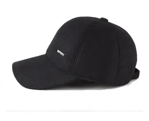 Detail view of winter baseball cap with side metal sport tag and wool fabric texture