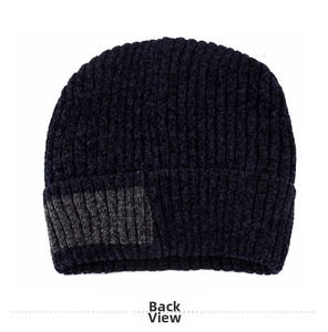 Detailed view of the navy blue knit beanie with gray ribbed texture and warm lining