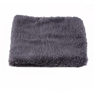 Detail view of thick dark grey chenille neck warmer with soft plush faux fur texture