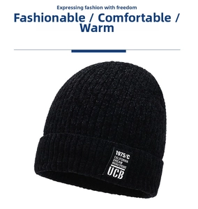 Detail of black thick knitted beanie with California Dream patch and ribbed texture