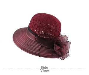 Detail view of burgundy knitted sun hat with large floral mesh and sheer brim