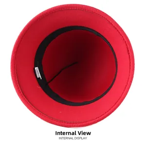 Detail view of the red winter cloche hat interior with adjustable drawstring and sweatband