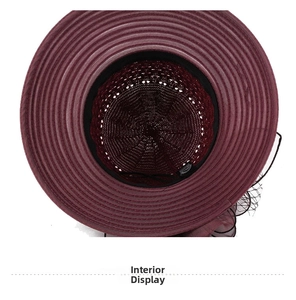 Interior view of burgundy knit sun hat featuring mesh crown and black sweatband detail