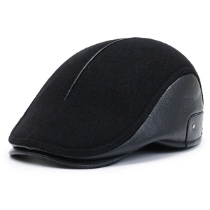 Men's winter flat cap in black wool and leather patchwork with ear flaps and metal studs