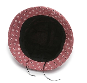 Floral bucket hat detail showing breathable black mesh lining and adjustable drawcord