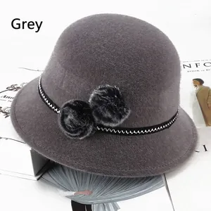 Elegant grey faux mink bucket hat with pom-pom decor and geometric ribbon for women