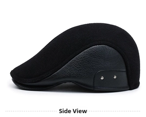 Close-up of black wool fabric and faux leather brim of the men's winter flat cap