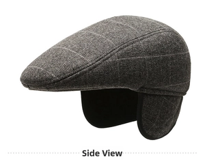 Detail view of winter grey plaid flat cap with protective ear flaps for men's warmth