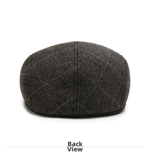 Rear view of winter flat cap for men showing grey wool fabric and diamond stitching