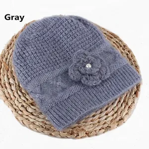 Winter grey knit beanie for women featuring a woven flower detail and pearl accent