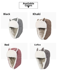 Detail of winter trapper hats with cat ears in houndstooth fabric and plush lining