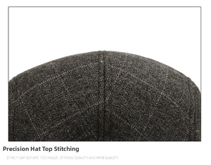 Detail of high-quality stitching and woven texture on a men's winter duckbill flat cap
