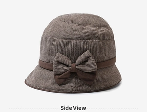 Detail of vintage wool cloche hat with herringbone pattern and side bow decoration