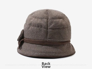 Back view of brown herringbone bucket hat featuring a fabric bow and hemmed edge
