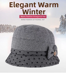 Detail of winter cloche hat featuring black and white houndstooth pattern and decorative bow