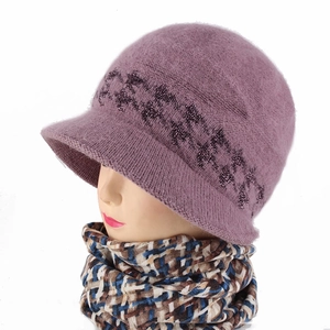 Detail of purple winter knit bucket hat with glitter floral pattern and plaid scarf