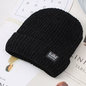 Detail of black knit beanie with soft chenille texture and Classic Collection label