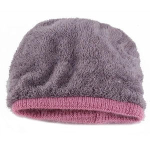 Close-up of grey plush faux fur and pink ribbed knit cuff on the winter beanie