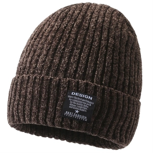 Close-up of brown chenille knit beanie showing thick ribbed texture and design label