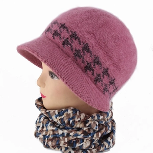 Detail of pink knitted visor beanie with sequins and plaid scarf on head display