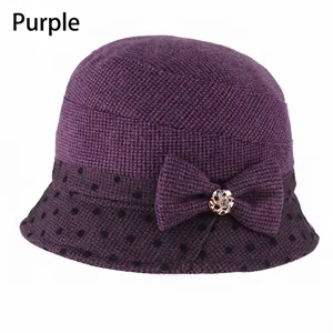Elegant purple knitted cloche hat with black polka dot ribbon and flower rhinestone