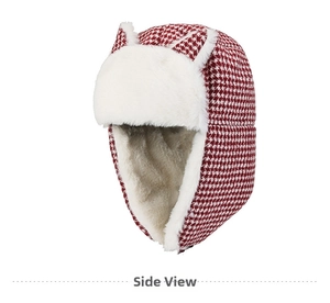 Detail view of red houndstooth trapper hat with white faux fur lining and cute cat ears