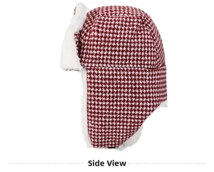 Side view detail of red houndstooth trapper hat with soft white faux fur lining for winter