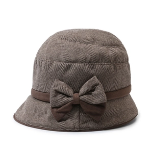 Elegant brown herringbone wool cloche hat with a large bow decoration for winter women's fashion