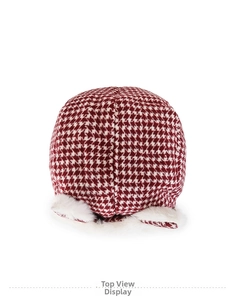 Top view of winter trapper hat with red and white houndstooth pattern and faux fur trim