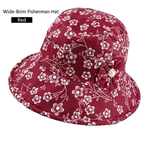 Red wide brim bucket hat with white floral print and pearl flower accessory for women