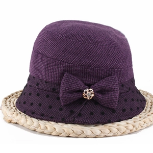 Elegant purple winter bucket hat with a bow, polka dots, and floral rhinestone buckle detail