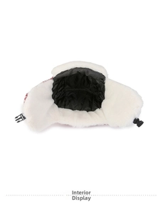 Detail view of winter trapper hat with white faux fur lining and black quilted interior