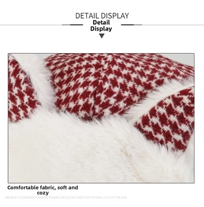 Detail of red houndstooth corduroy trapper hat with soft white faux fur lining for warmth