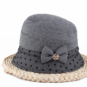 Elegant grey houndstooth cloche hat with polka dot brim and floral bow decoration