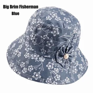 Detail of navy blue floral sun hat with fabric flower and pearl on the wide brim