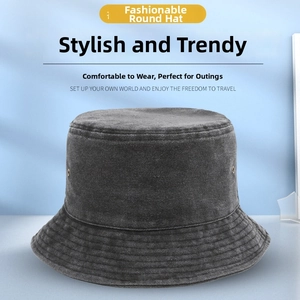 Detail of grey washed denim bucket hat with parallel stitching on the brim and metal eyelets