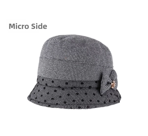 Detail view of winter cloche hat with houndstooth pattern and floral bow decoration