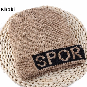 Close-up of khaki chenille knit beanie featuring SPORT letter embroidery and thick texture
