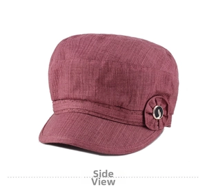Close-up of knit texture and decorative floral metal buckle on women octagonal hat