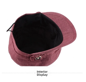 Detailed interior view of the dark pink corduroy newsboy cap showing black fabric lining