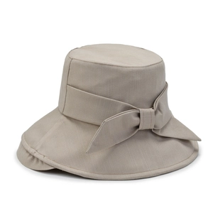 Solid khaki sun bucket hat with a wide decorative bow for women on a white background