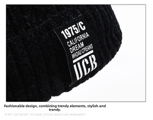 Close-up of thick black ribbed knit beanie featuring a retro California woven patch label