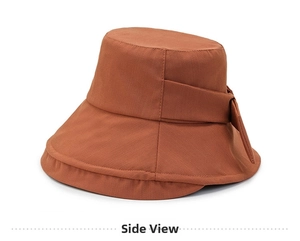 Side view of caramel bucket hat with foldable wide brim and fabric bow detail