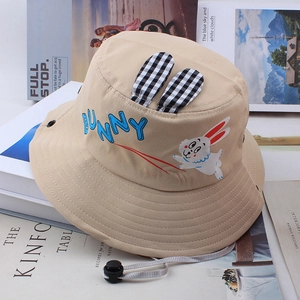 Detail of beige kids bucket hat with bunny ears and adjustable windproof strap