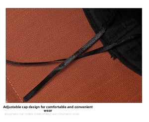 Detail of adjustable cap circumference with drawstring on orange knit sun hat