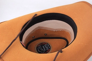 Detail view of the brown leather cowboy hat interior with sweatband and adjustable wind rope